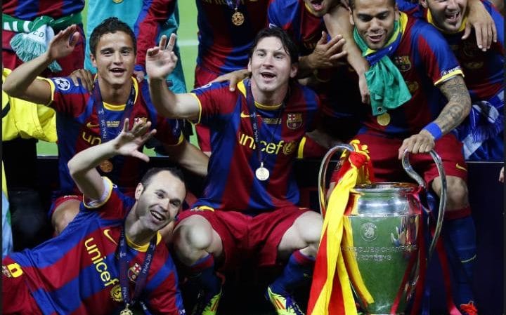 Barcelona pose with the trophy after winning their second Champions League in three years by defeating Manchester United. CREDIT: GETTY IMAGES.